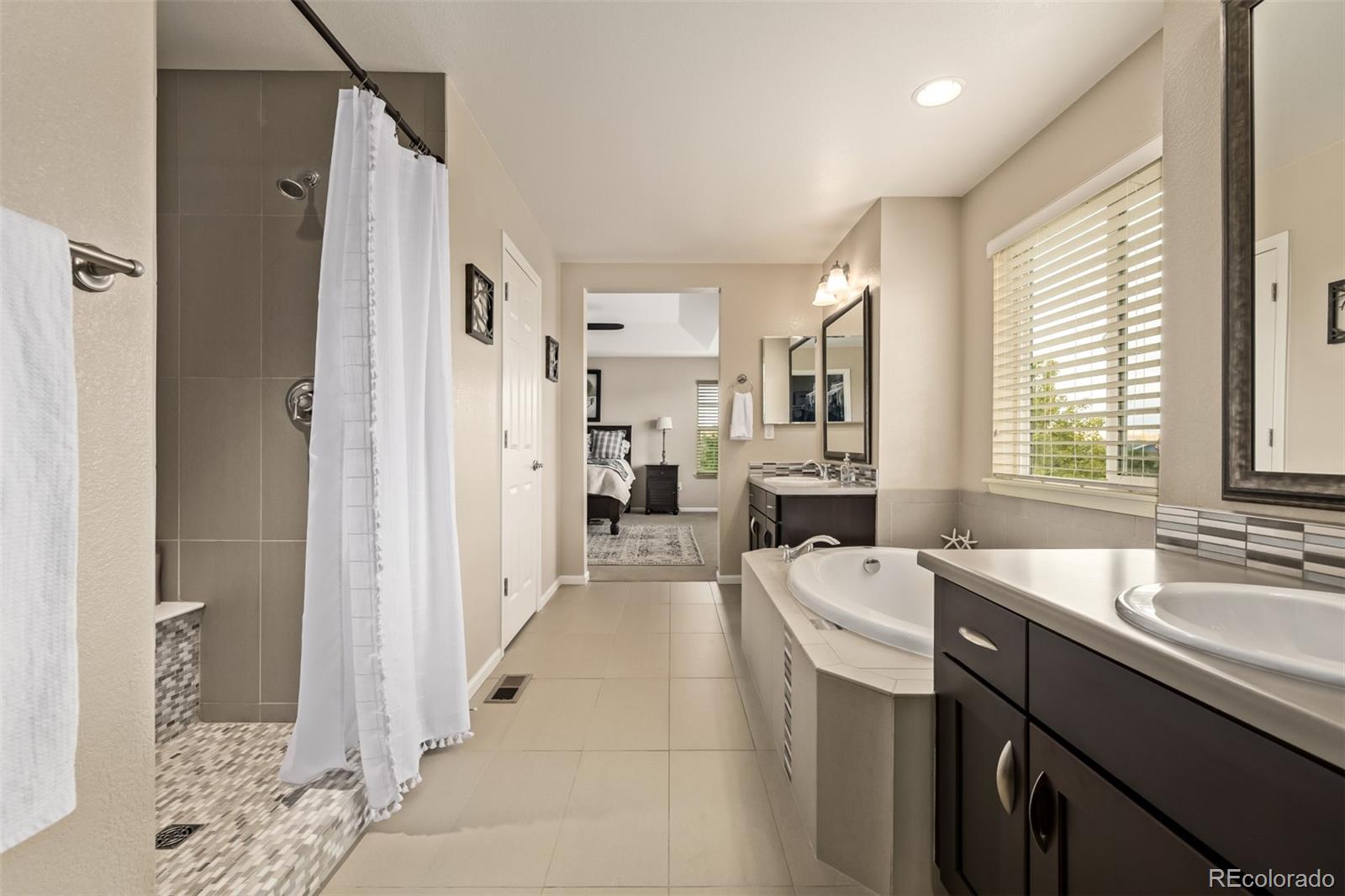 2289 Moss Place Erie, CO 80516 - Photo 23 of 45 a kitchen with a sink refrigerator and window