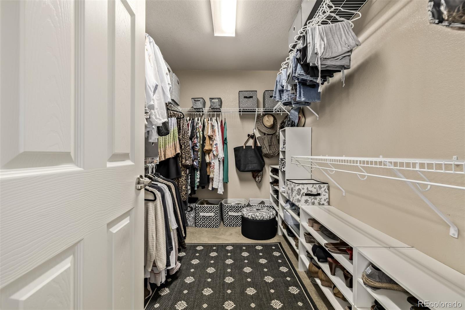 2289 Moss Place Erie, CO 80516 - Photo 24 of 45 a view of a closet with storage