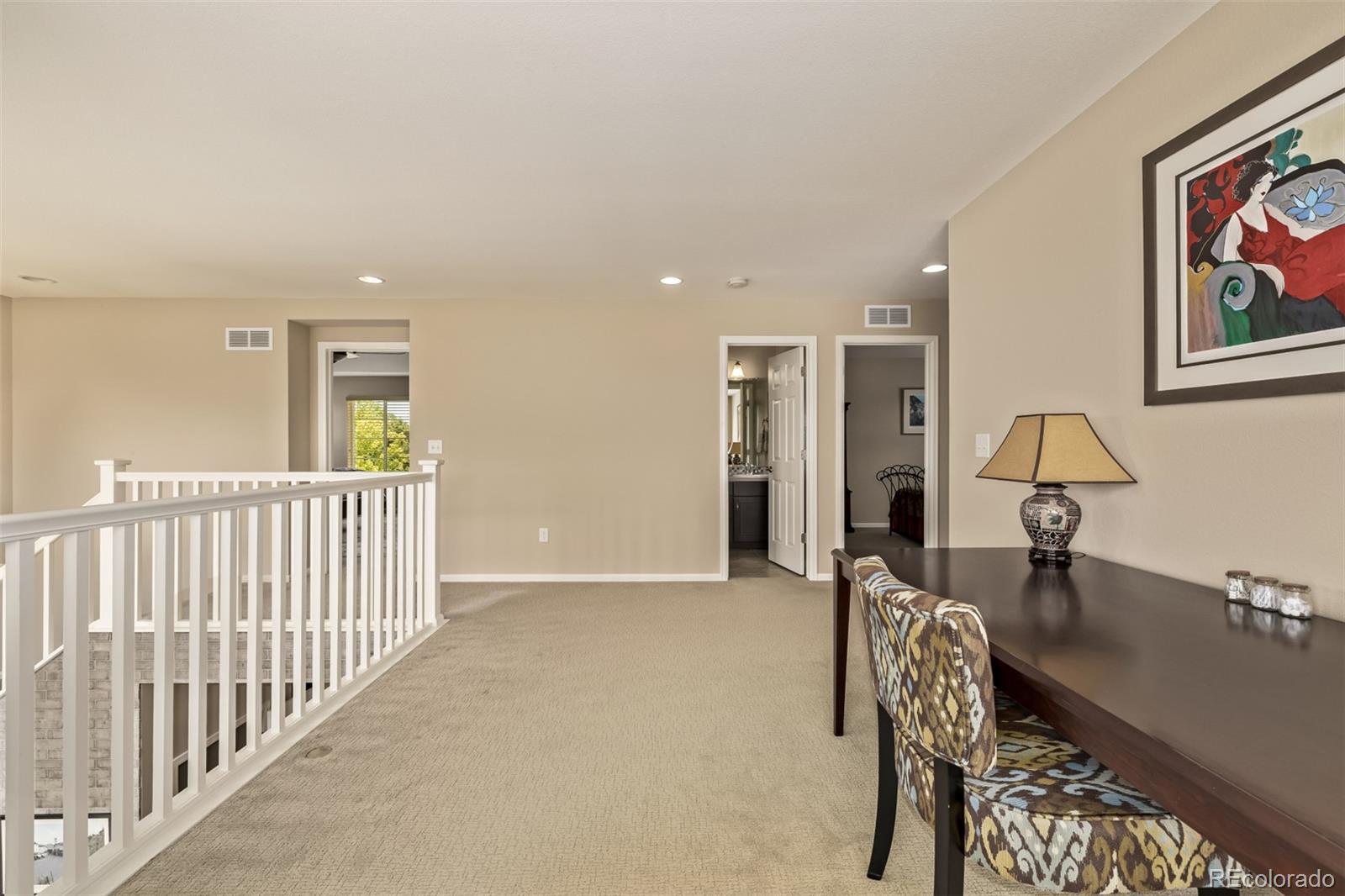 2289 Moss Place Erie, CO 80516 - Photo 25 of 45 a view of a hallway with seating area