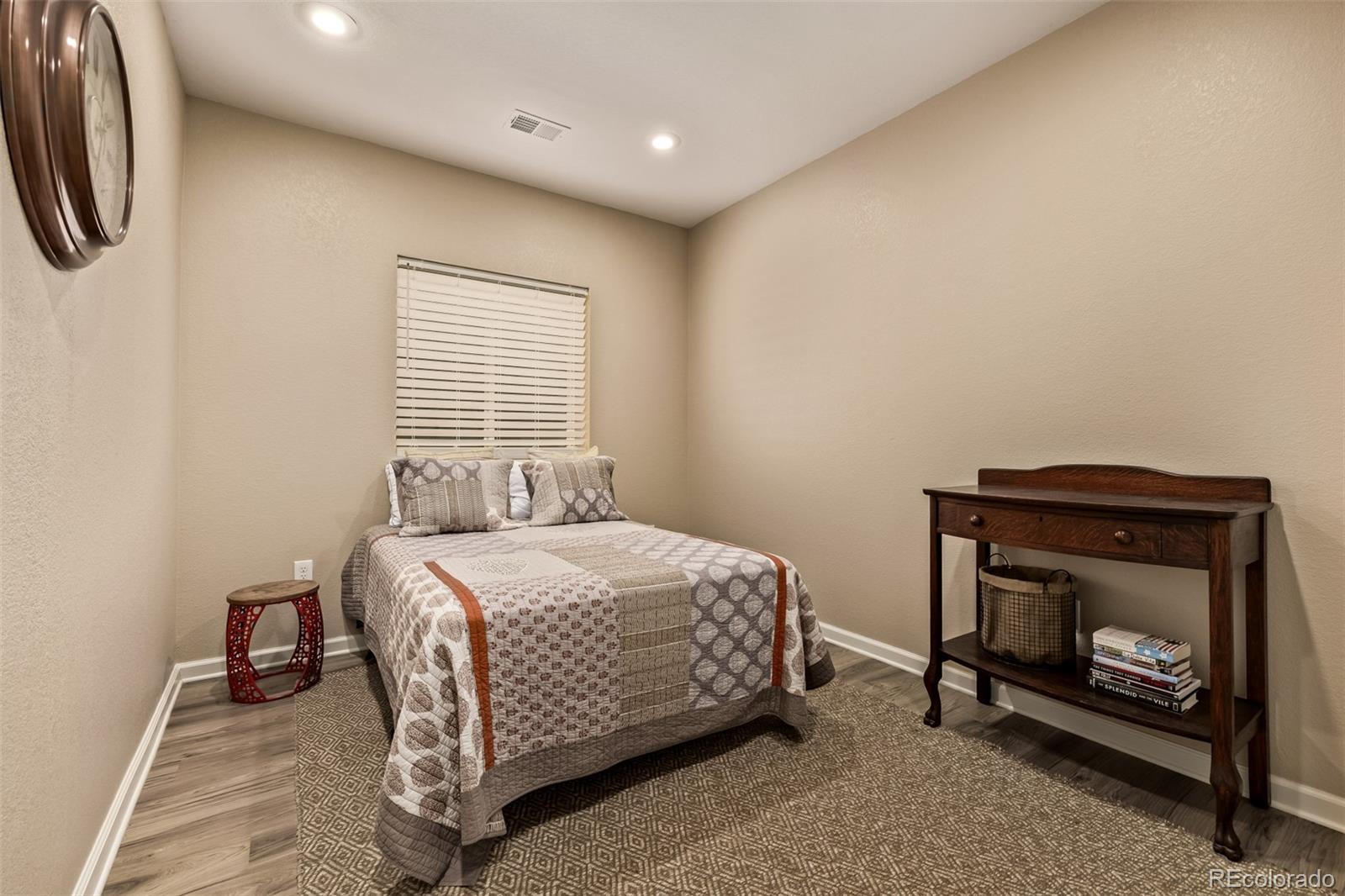 2289 Moss Place Erie, CO 80516 - Photo 26 of 45 a bedroom with a bed and a fireplace