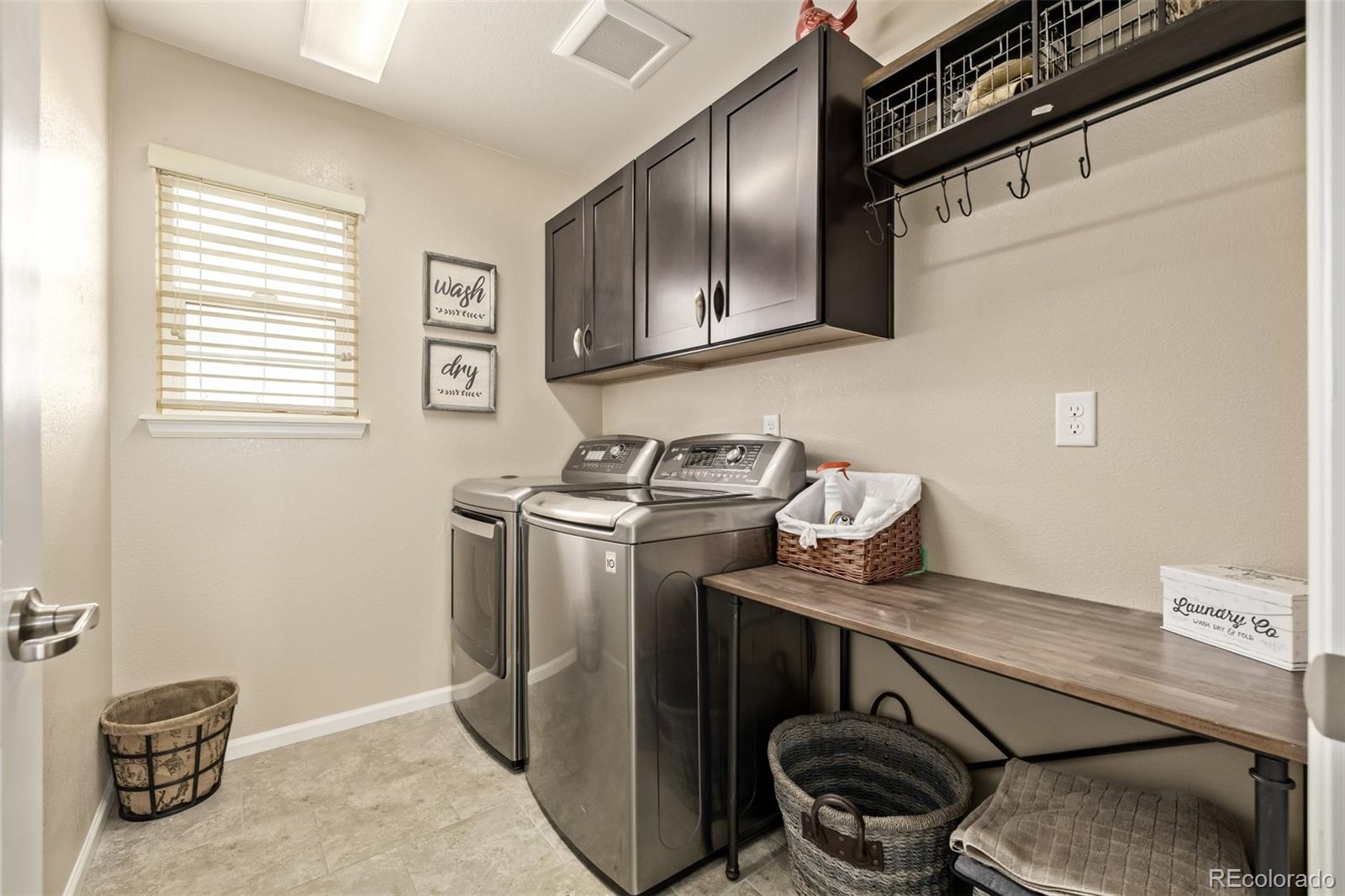 2289 Moss Place Erie, CO 80516 - Photo 27 of 45 a utility room with dryer and washer