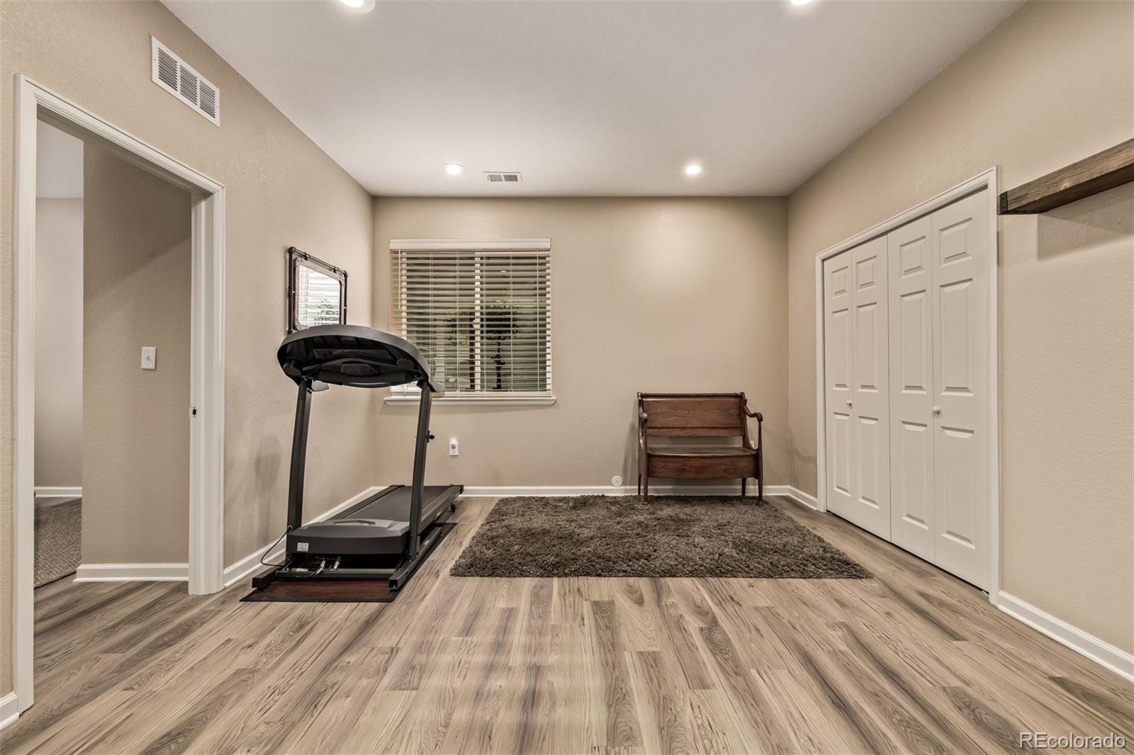 2289 Moss Place Erie, CO 80516 - Photo 29 of 45 a living room with a couch and a table