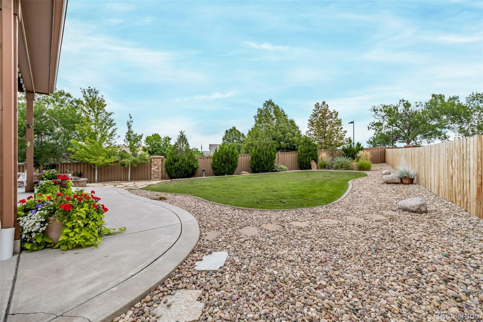 2289 Moss Place Erie, CO 80516 - Photo 37 of 45 a view of a garden with a pathway