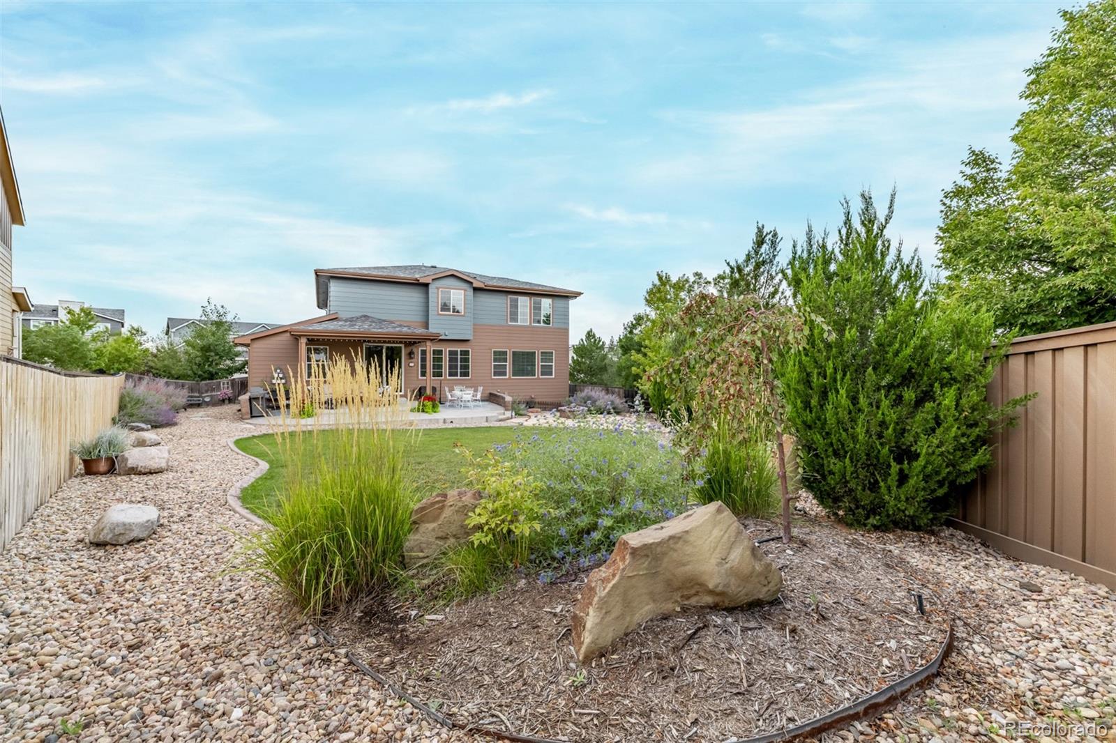 2289 Moss Place Erie, CO 80516 - Photo 38 of 45 a front view of a house with garden