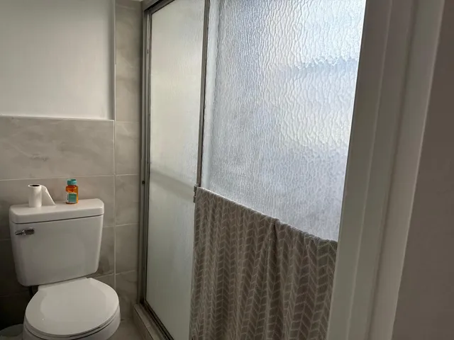 a bathroom with a toilet and a sink