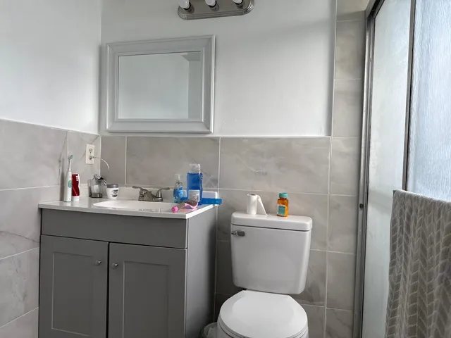 a bathroom with a sink toilet and vanity