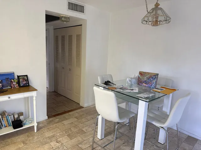 a view of a dining room with furniture