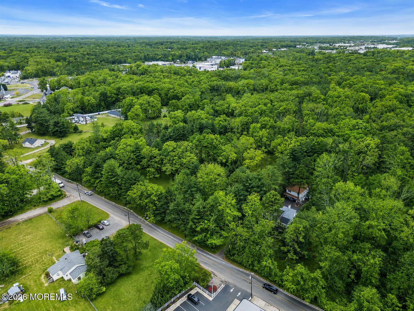 269 Alexander Avenue Howell, NJ 07731 - Photo 42 of 43 a view of a lush green outdoor space with a lake view