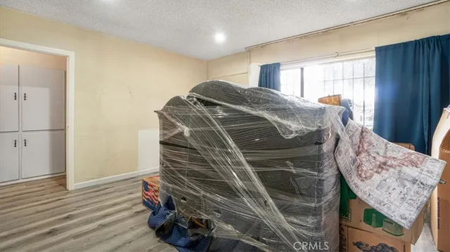 a view of a livingroom with furniture and wooden floor