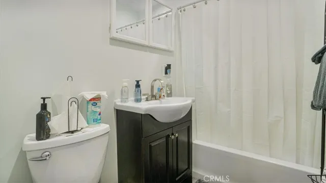 a bathroom with a sink a mirror and vanity