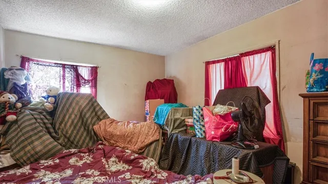 a living room with furniture and a lamp
