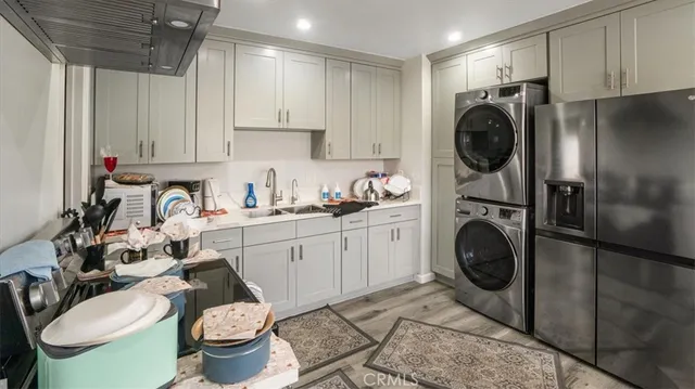 a kitchen with a sink a stove and cabinets