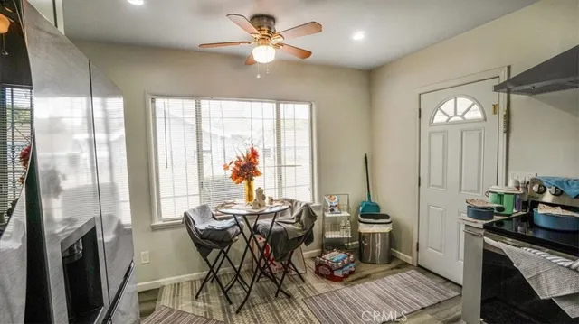 a view of a dining room with furniture window and outside view
