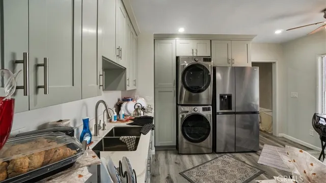 a view of a storage and utility room with stainless steel appliances
