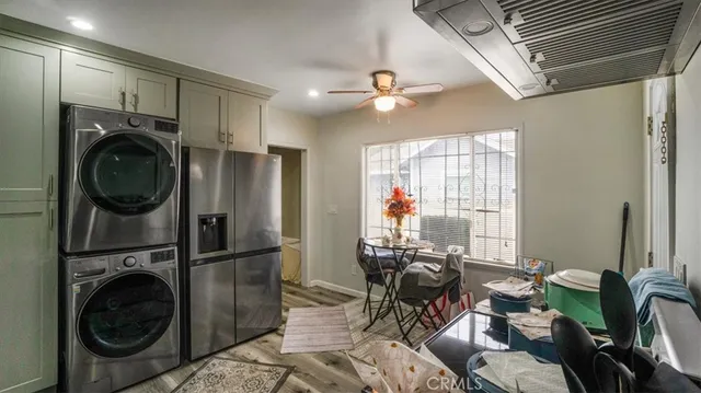 a view of a hallway with washer and dryer