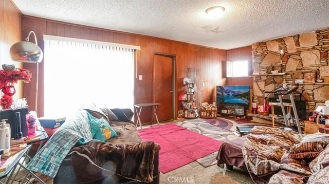 a bedroom with bed and a couch