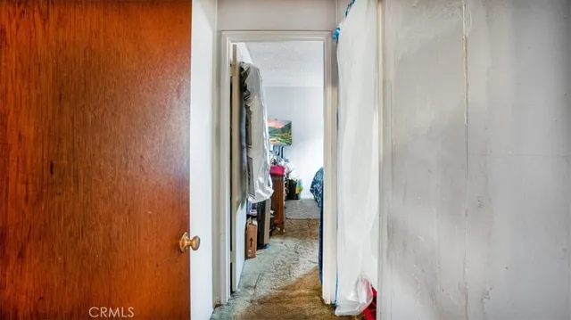 a bedroom with a bed and a mirror