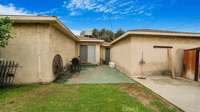 a backyard of a house with seating space