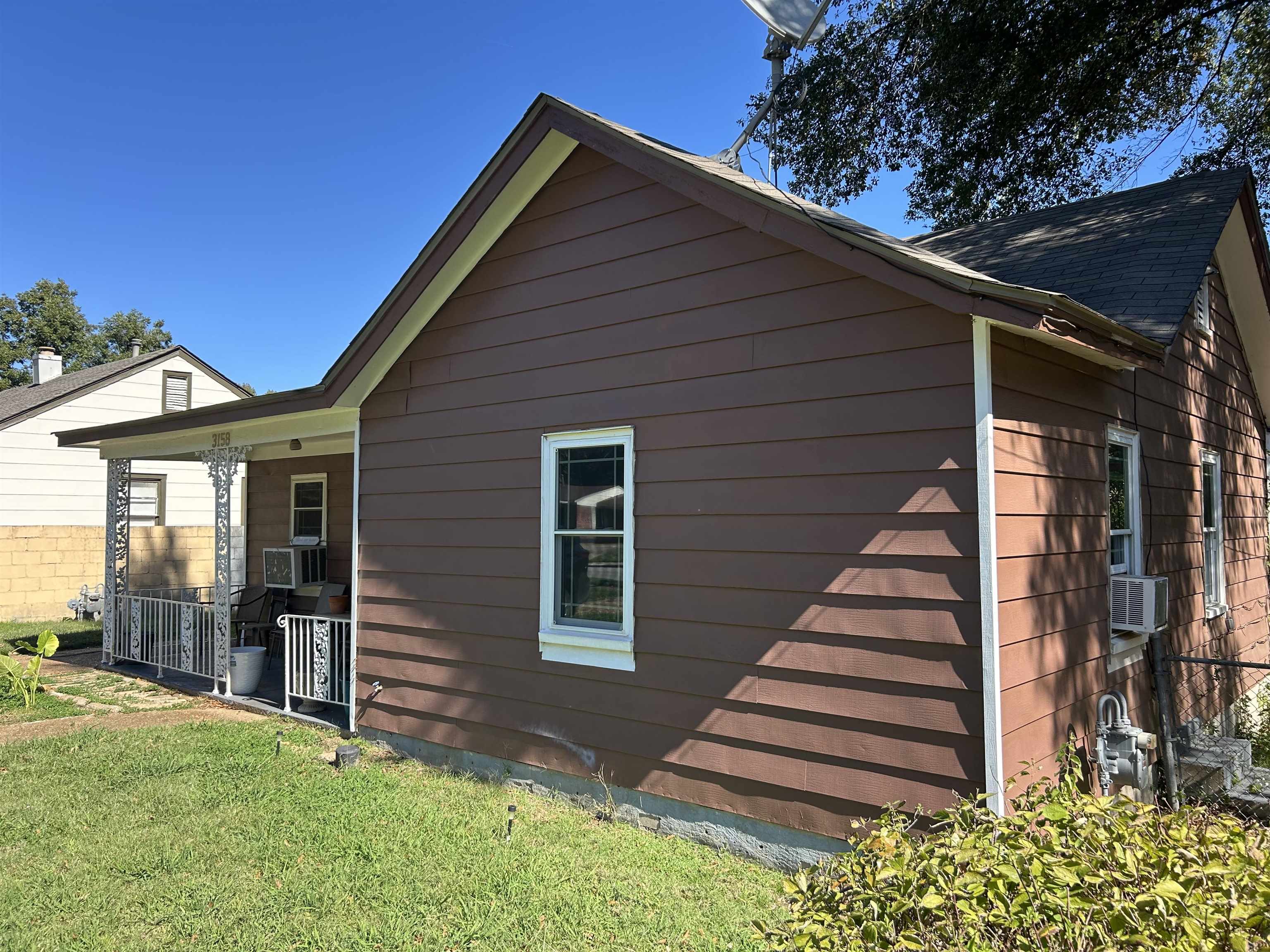 3158 Ford Road Memphis, TN 38109 - Photo 19 of 22 a front view of a house with a yard