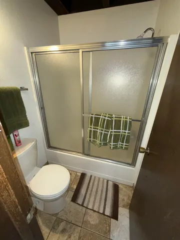 a bathroom with a double vanity sink mirror and toilet