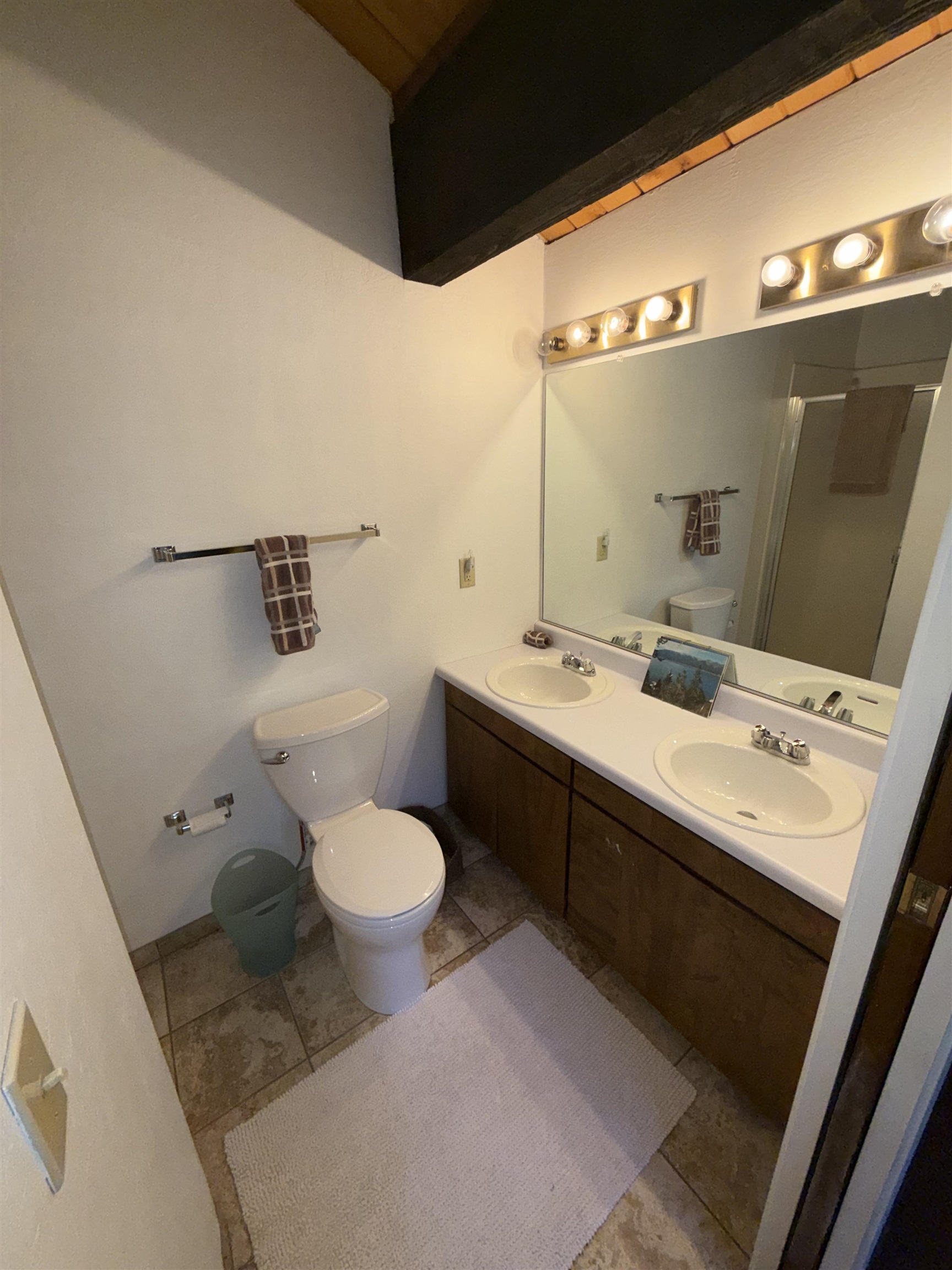 1001 Commonwealth Drive, Unit 97 Kings Beach, CA 96143 - Photo 21 of 28 a bathroom with a double vanity sink mirror and toilet