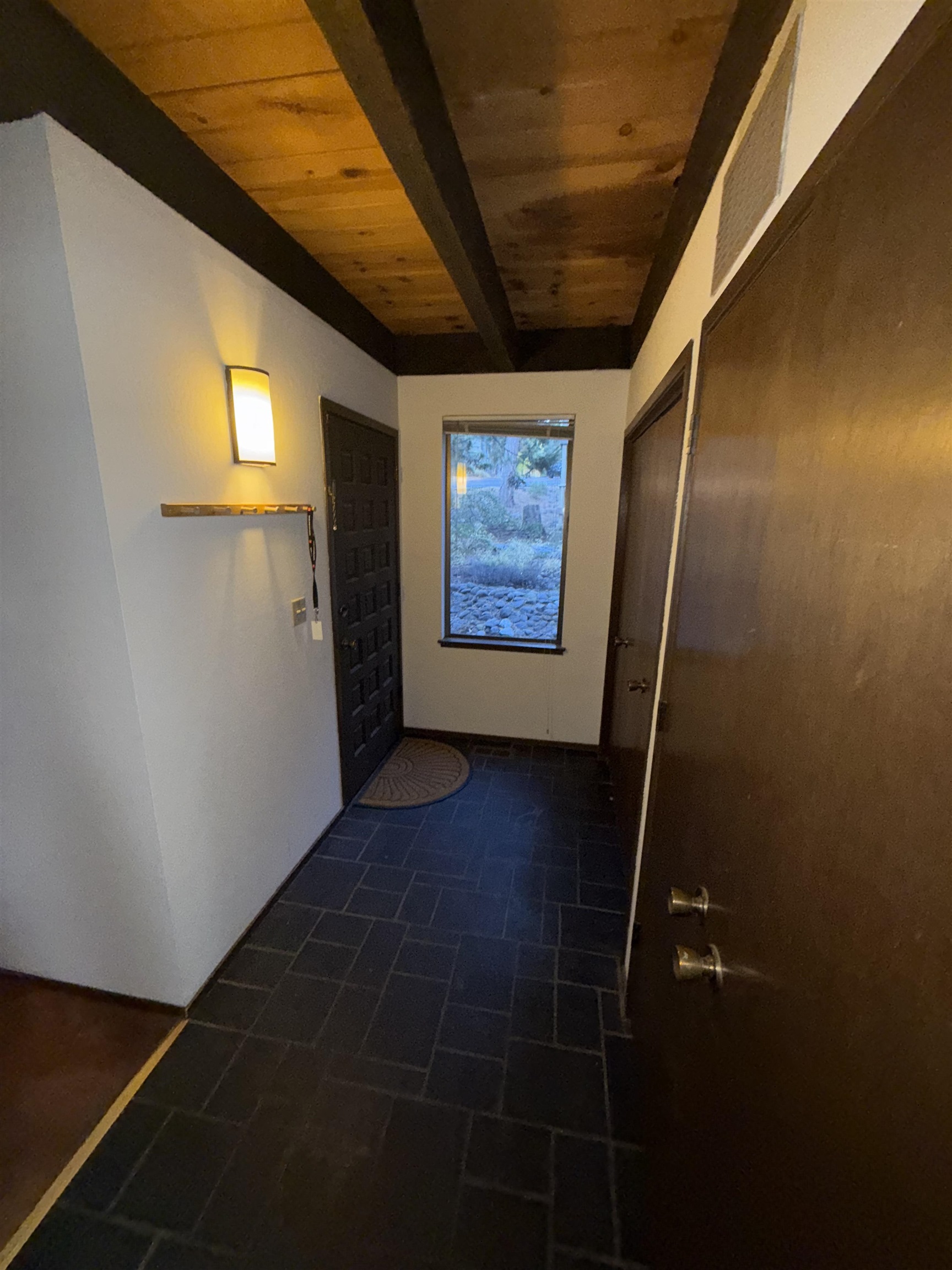 1001 Commonwealth Drive, Unit 97 Kings Beach, CA 96143 - Photo 23 of 28 a view of hallway with stairs and wooden floor