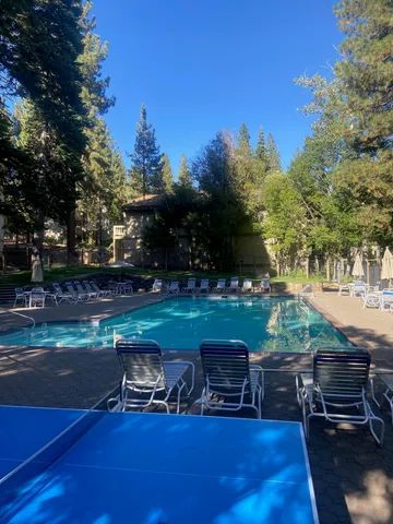 a backyard of a house with outdoor seating