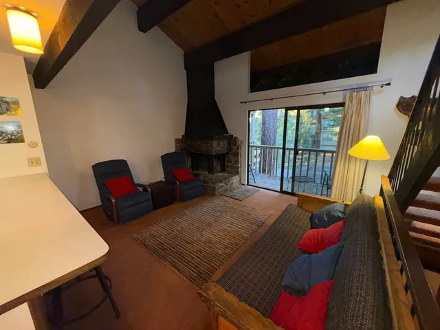 a living room with furniture fireplace and a flat screen tv