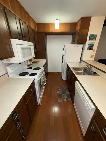 a kitchen that has a sink and a stove