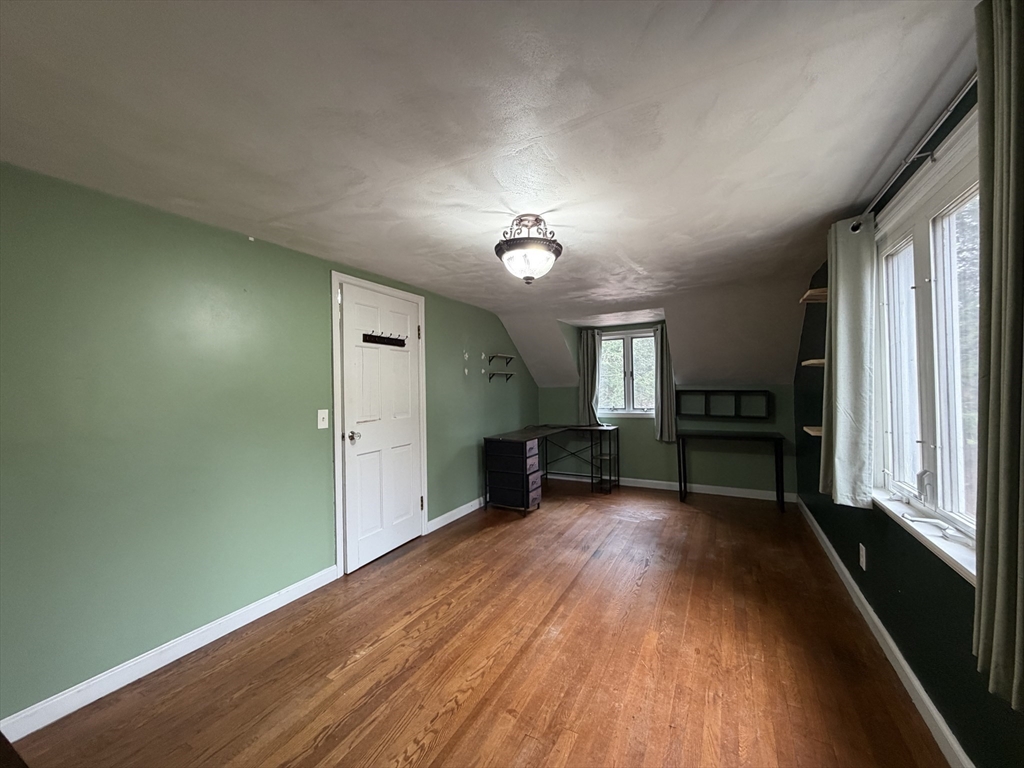 264 Flynt Street Palmer, MA 01069 - Photo 14 of 21 wooden floor in an empty room with a window