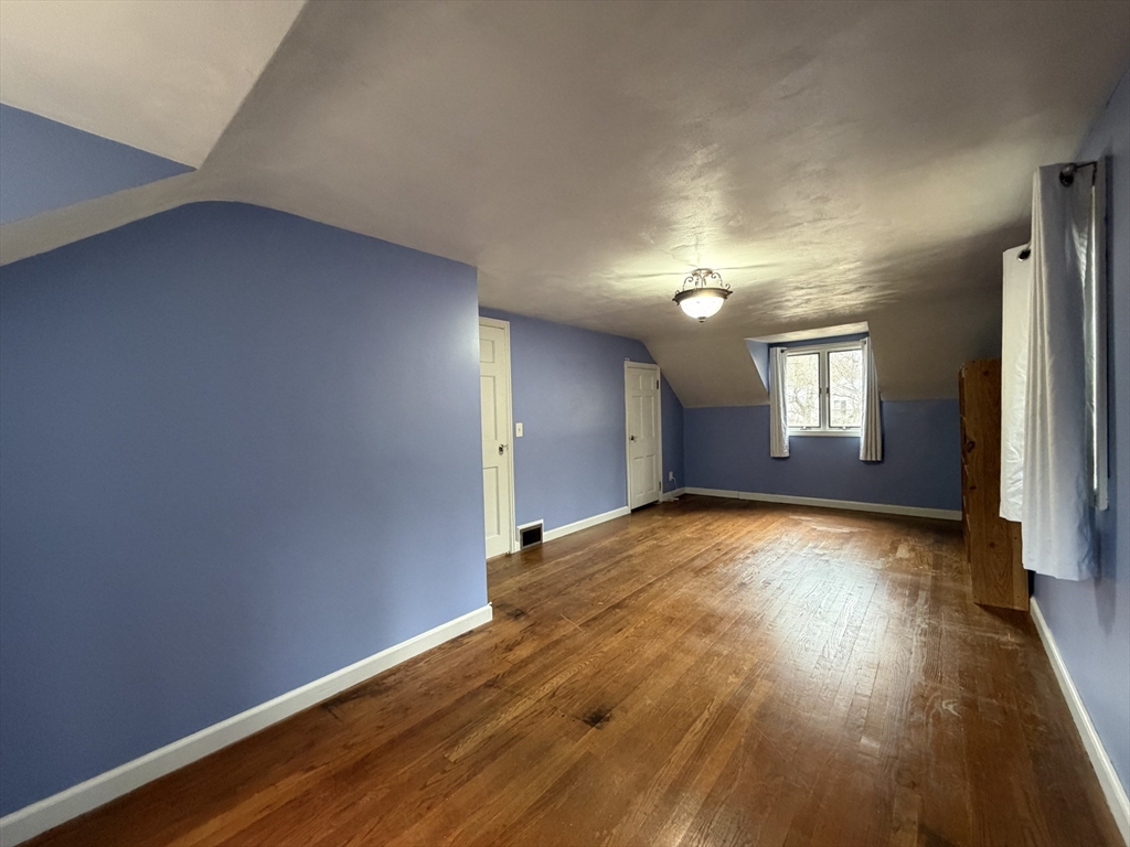 264 Flynt Street Palmer, MA 01069 - Photo 16 of 21 a view of empty room with wooden floor and fan