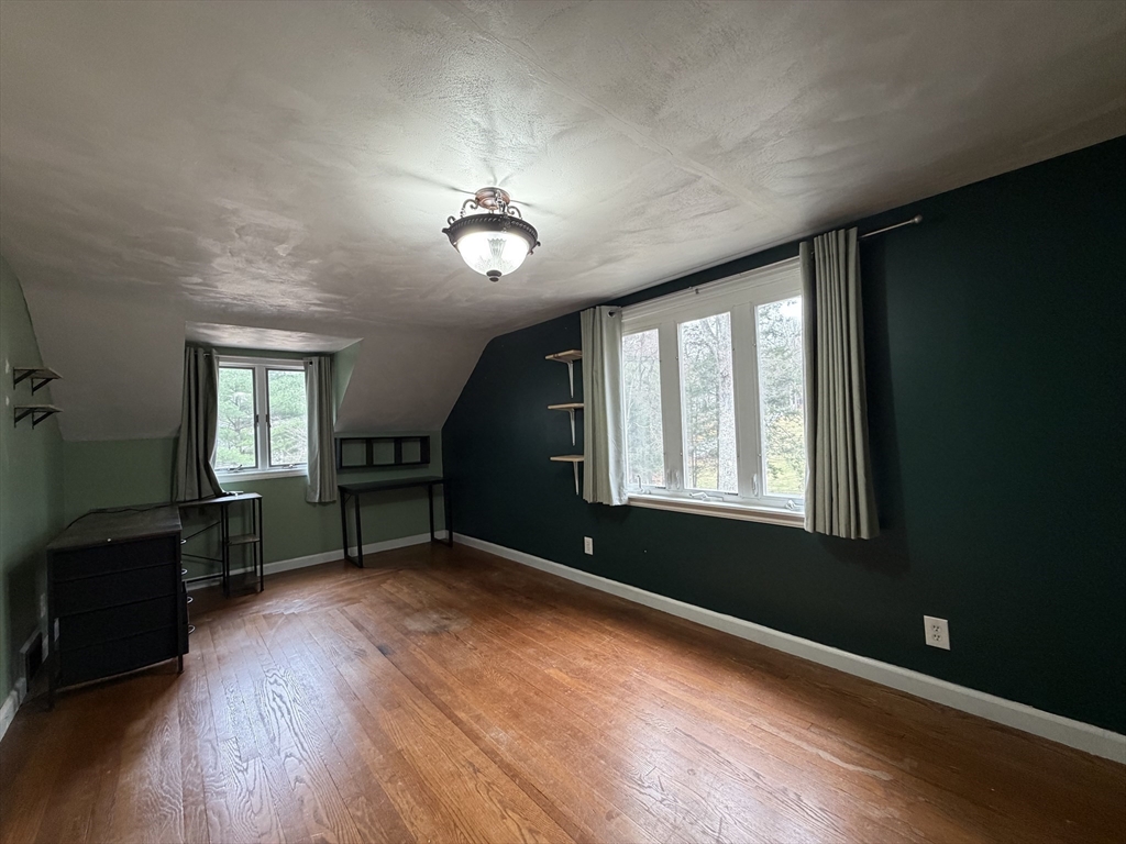 264 Flynt Street Palmer, MA 01069 - Photo 20 of 21 wooden floor in an empty room with a window