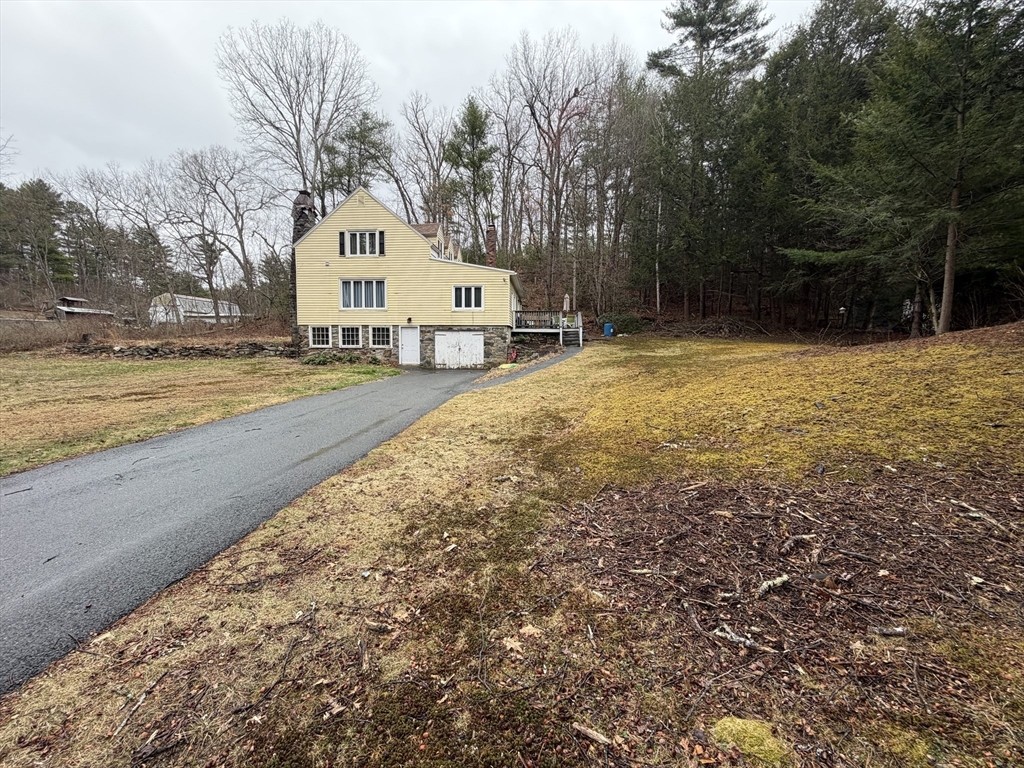264 Flynt Street Palmer, MA 01069 - Photo 3 of 21 a house with trees in front of it