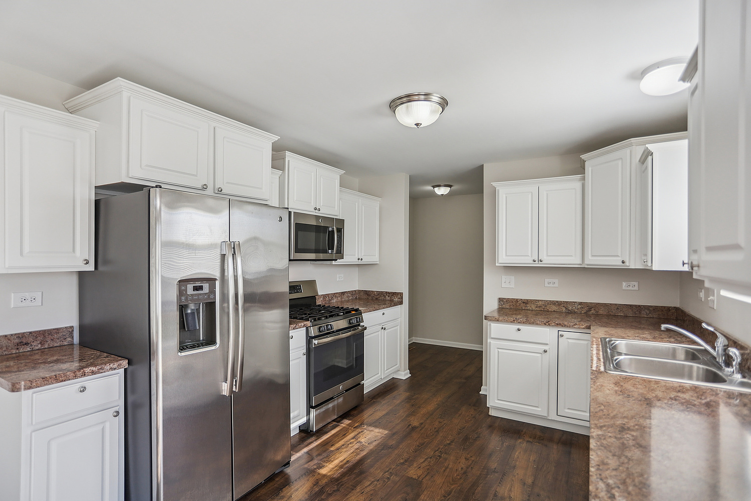 1672 Glenbrooke Lane New Lenox, IL 60451 - Photo 4 of 15 a kitchen with cabinets stainless steel appliances and wooden floor