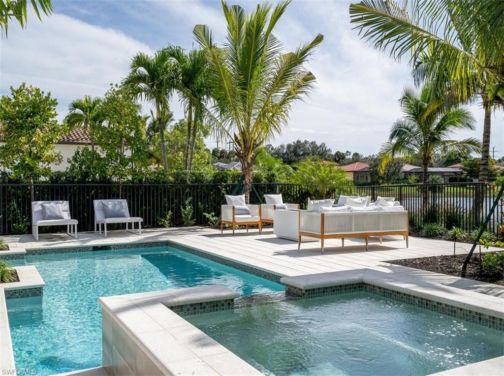 2059 Cambridge Park Drive Naples, FL 34109 - Photo 12 of 15 a view of a house with swimming pool and sitting area