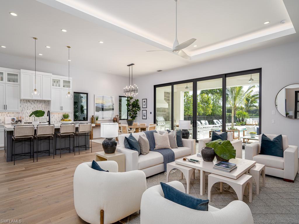 2059 Cambridge Park Drive Naples, FL 34109 - Photo 3 of 15 a living room with furniture and a large window