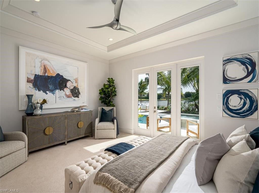 2059 Cambridge Park Drive Naples, FL 34109 - Photo 9 of 15 a bedroom with a bed mirror and window