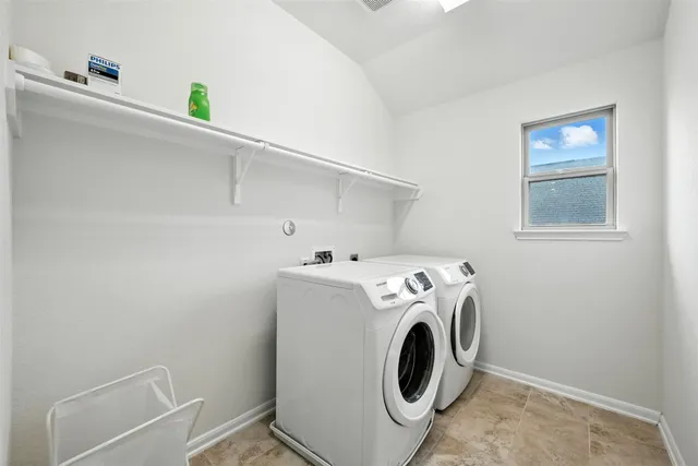 a utility room with dryer and washer