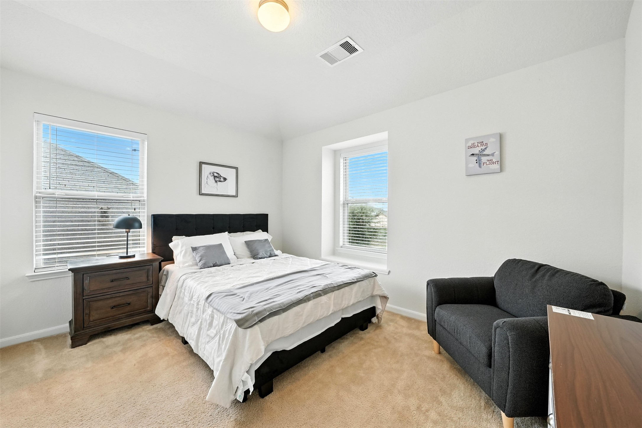 15410 Rosehill Summit Lane Houston, TX 77044 - Photo 22 of 30 a bedroom with bed couch and window