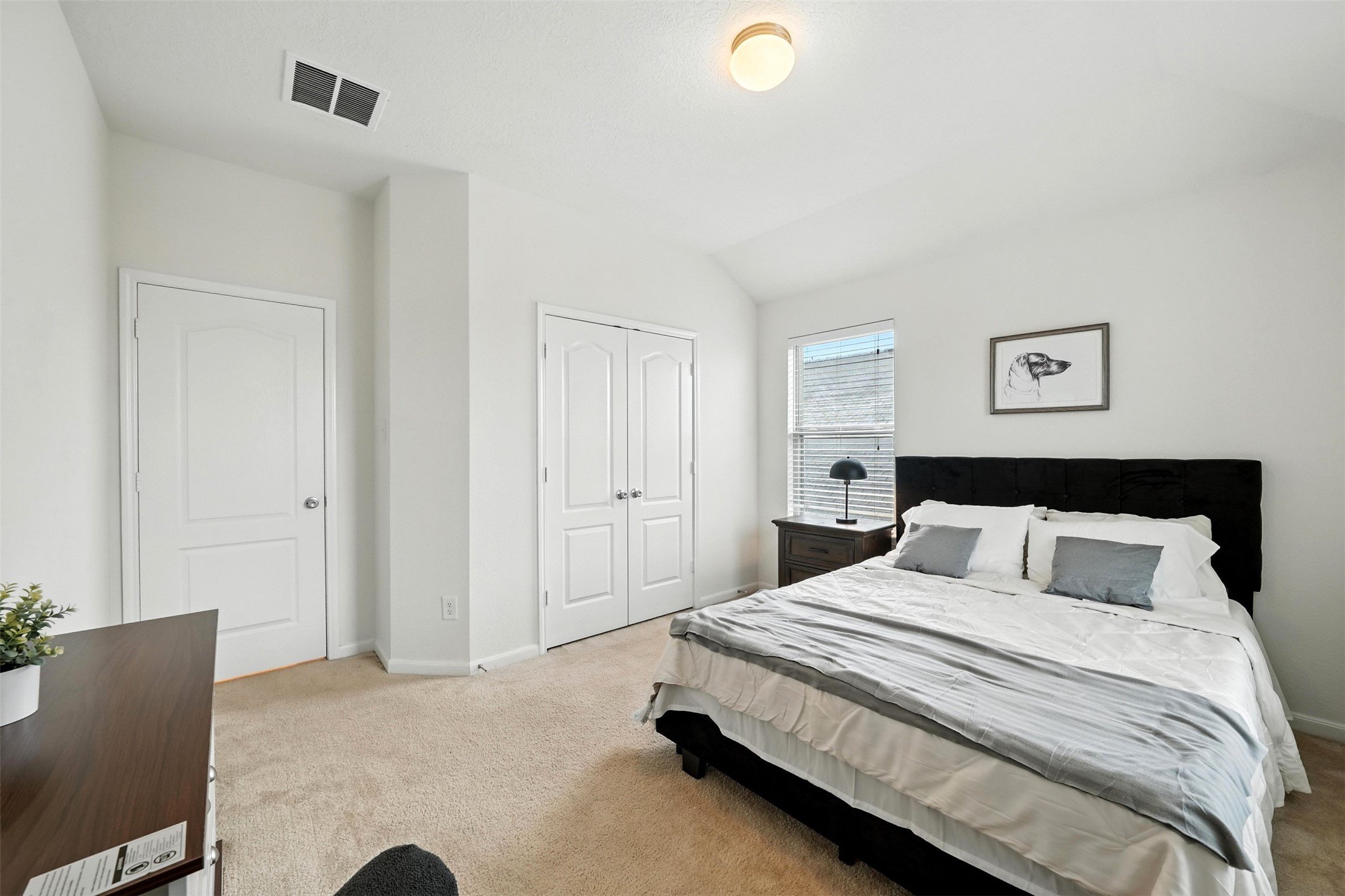 15410 Rosehill Summit Lane Houston, TX 77044 - Photo 23 of 30 a bedroom with a bed and a couch