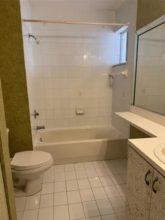 a bathroom with a sink a toilet and a bathtub