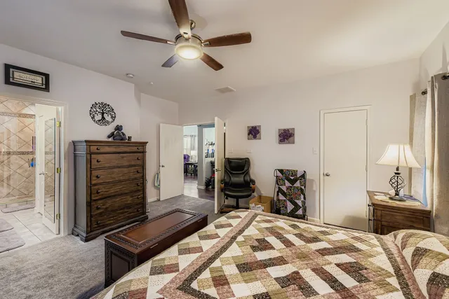 a bedroom with a bed and a dresser