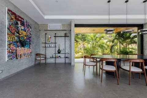 a view of a livingroom with furniture and window