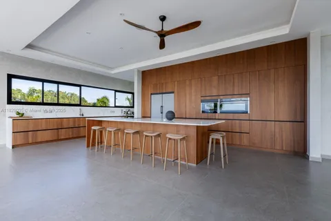 a view of a kitchen with furniture and window