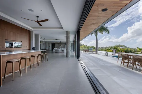 a view of a patio with a table and chairs
