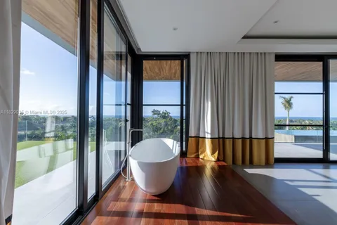 a view of kitchen with a large window and wooden floor