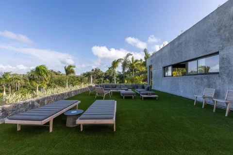 a view of a backyard with sitting area