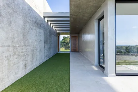a view of a hallway with an entryway