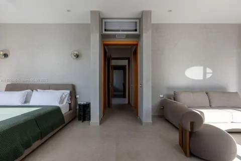 a bed room with a bed and a couch