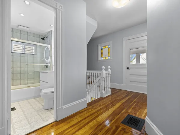 a bedroom with a bed and the view of bathroom